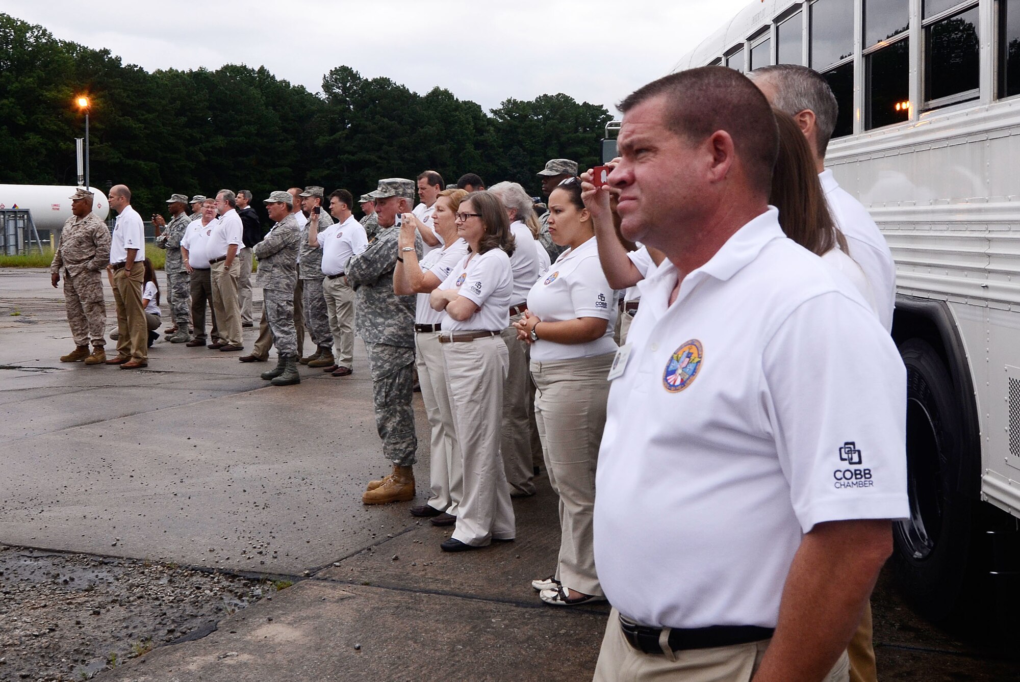 The Dobbins Fire Department crash response team performs a simulated aircraft fire demonstration for local Honorary Commanders Association members touring Dobbins Air Reserve Base, Ga., Aug. 21.  Dobbins Day program HCA attendees  experienced additional base sites including the Eastern Regional C-130 Simulator, Force Support Combat Training Center, base operations, weather station and air traffic control tower, as well as static displays by Explosive Ordnance Disposal team, C-130 Hercules air crews and briefings from 94th Aeromedical Evacuation Squadron personnel. (U.S. Air Force photo/Don Peek)