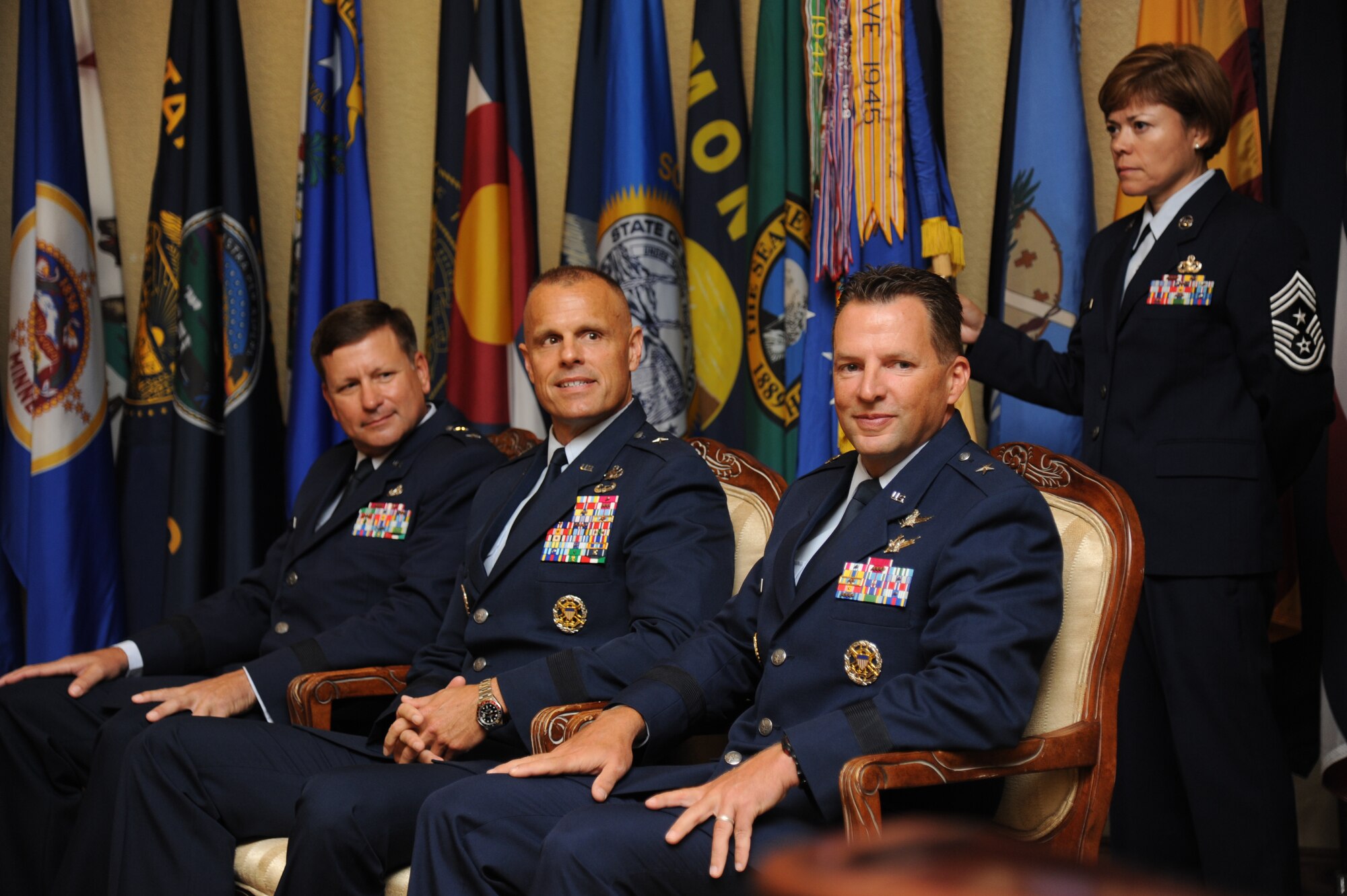 Maj. Gen. Leonard Patrick, 2nd Air Force commander; Brig. Gen. Brad Spacy, outgoing 81st Training Wing commander; Brig. Gen. Patrick Higby, incoming 81st TRW commander, and Chief Master Sgt. Angie Johnson, 81st TRW command chief, listen to introductions during the 81st TRW change of command ceremony Aug. 23, 2013, at the Bay Breeze Event Center, Keesler Air Force Base, Miss.  Spacy has been selected for a new assignment as director for logistics, installations and mission support at Headquarters United States Air Forces in Europe, Ramstein Air Base, Germany.  (U.S. Air Force photo by Kemberly Groue)