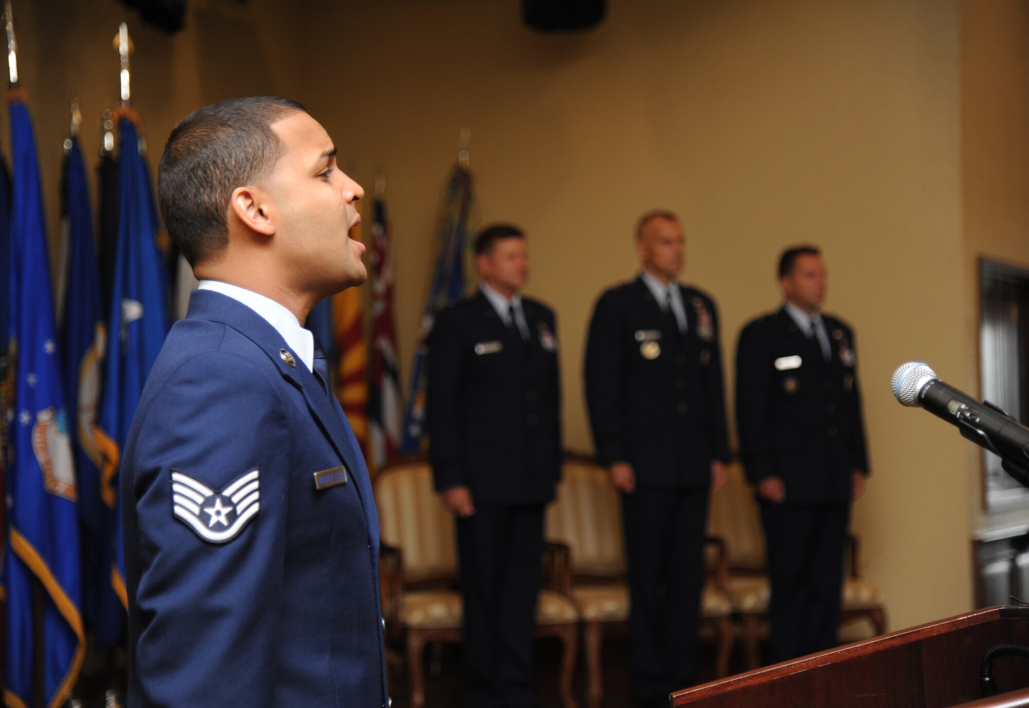 Staff Sgt. Emmanuel Maldonado Rosario, 81st Dental Squadron, sings the National Anthem during the 81st Training Wing change of command ceremony Aug. 23, 2013, at the Bay Breeze Event Center, Keesler Air Force Base, Miss.  Brig. Gen. Brad Spacy, outgoing 81st TRW commander, passed command to Brig. Gen. Patrick Higby, incoming 81st TRW commander, with Gen. Leonard Patrick, 2nd Air Force commander, as the presiding officer.  Spacy has been selected for a new assignment as director for logistics, installations and mission support at Headquarters United States Air Forces in Europe, Ramstein Air Base, Germany.  (U.S. Air Force photo by Kemberly Groue)