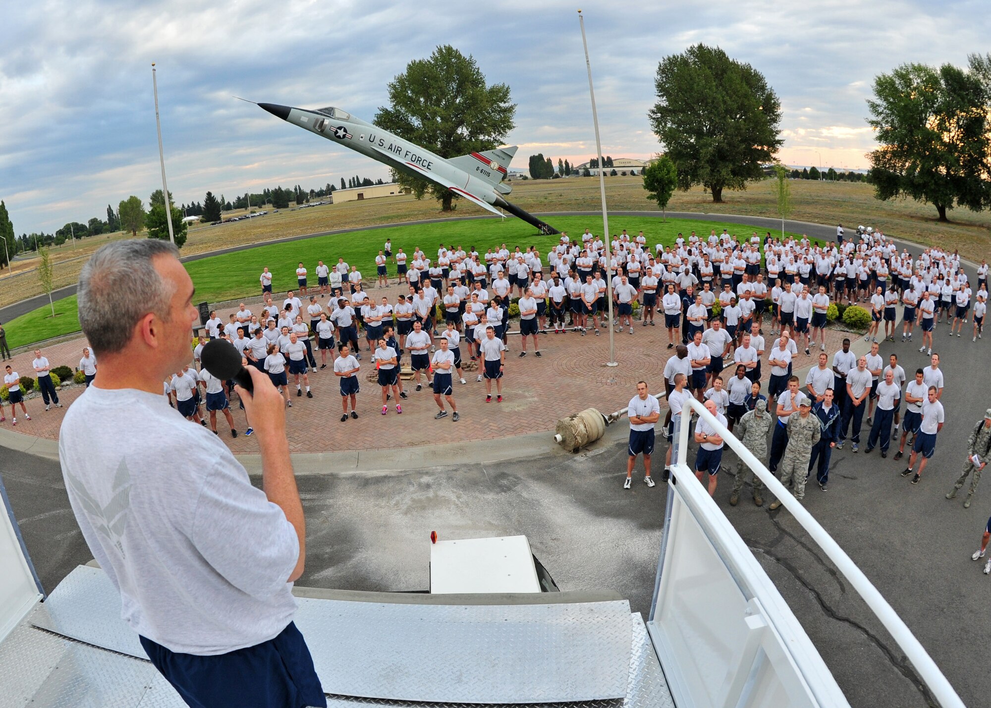Col. Brian Newberry, 92nd Air Refueling Wing commander, gives a speech to members of Team Fairchild before the wing run, Aug. 23, 2013. The run covered a 1.8 mile length, starting at the F-102A Delta Dagger static display. (U.S. Air Force photo by Senior Airman Taylor Curry/Released)