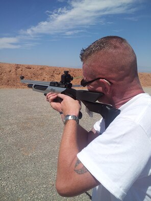In July 2013, Andrew Green, then a major working at Air Force Nuclear Weapons Center, represented Kirtland in an adaptive sports camp shooting competition. The camp was sponsored by the Air Force Wounded Warrior Program, which is enrolling more than 100 wounded military members every month. (Courtesy photo)