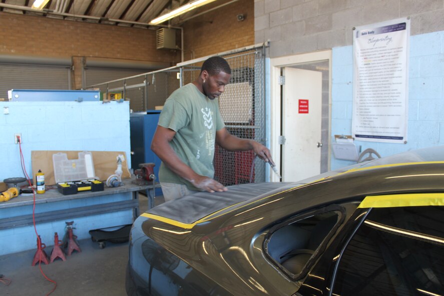 Ronnie Peele , civilian, works on his car in one of the Luke Air Force Base Auto Hobby Shop’s liftless stalls. (Courtesy photo)