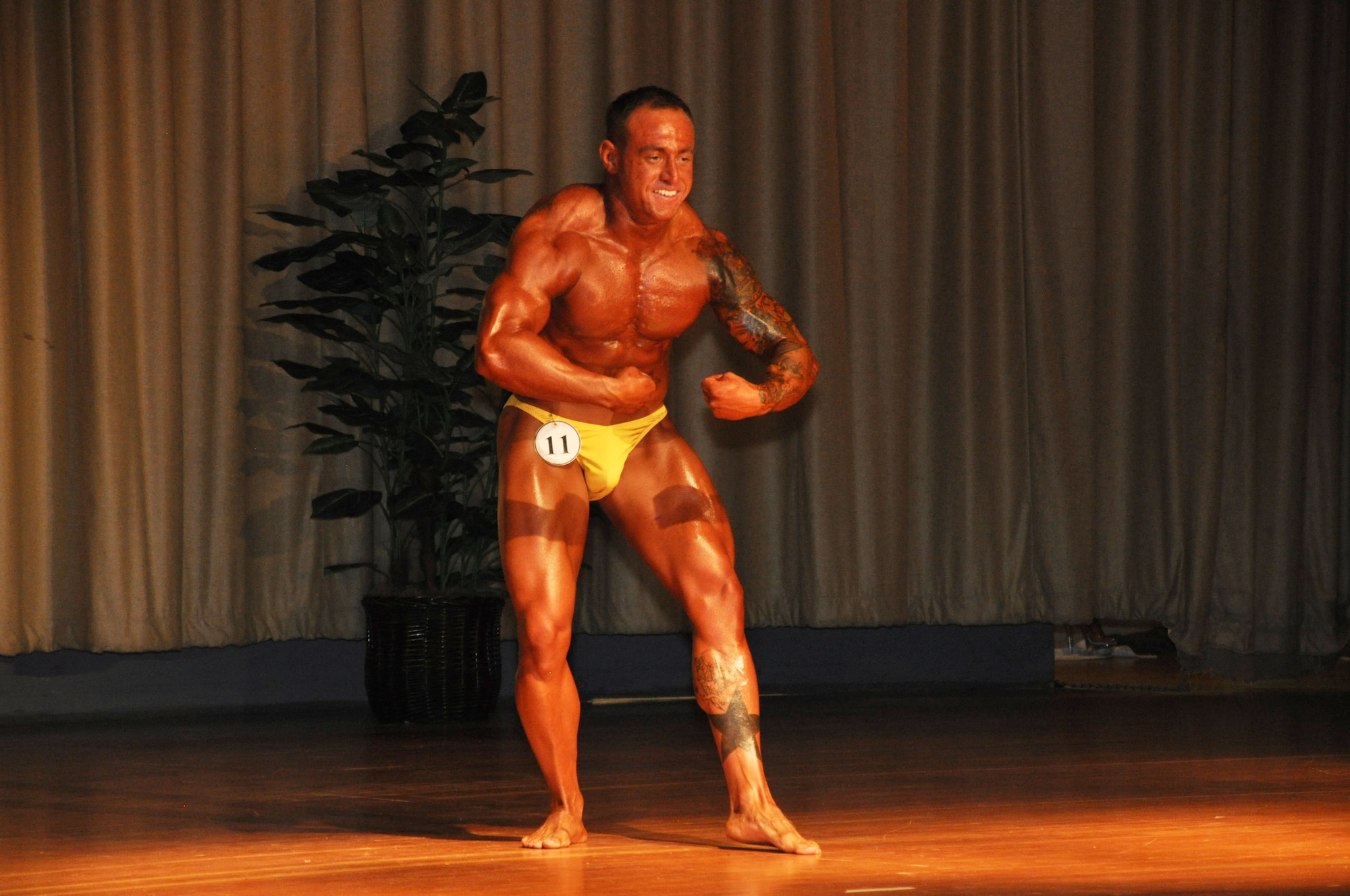 Donald Jenkins, 926th Aircraft Maintenance Squadron crew chief, Nellis Air Force Base, Nev., flexes for judges. He placed first in the men’s middleweight bodybuilding competition. (U.S. Air Force photo/Staff Sgt. Luther Mitchell Jr.)