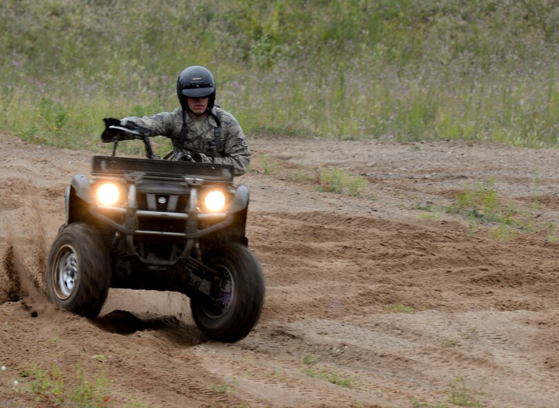 Staff Sgt. Adam Dierkhising, 133rd Security Forces Squadron, Minnesota Air National Guard, participates in a side hilling exercise in Arden Hills, Minn., Jul. 30, 2013. 
Dierkhising applies proper weight transferring and body positioning techniques needed to successfully control the ATV in a changing environment. 

(U.S. Air National Guard photo by Tech. Sgt. Amy M. Lovgren/Released) 