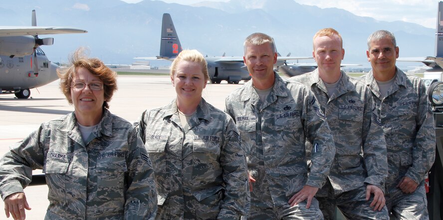 Volunteers who helped out their community and neighbors, (from left) Senior Airman Theresa Ducharme, Senior Airman Teresa Black, Senior Master Sgt. Dave Gilman, Master Sgt. Daniel Douglas, and Tech. Sgt. Andy Acosta. All are Reservists with the 39th Aerial Port Squadron, 302nd Airlift Wing, Peterson Air Force Base, Colo. (U.S. Air Force photo/Staff Sgt. Nathan Federico)
