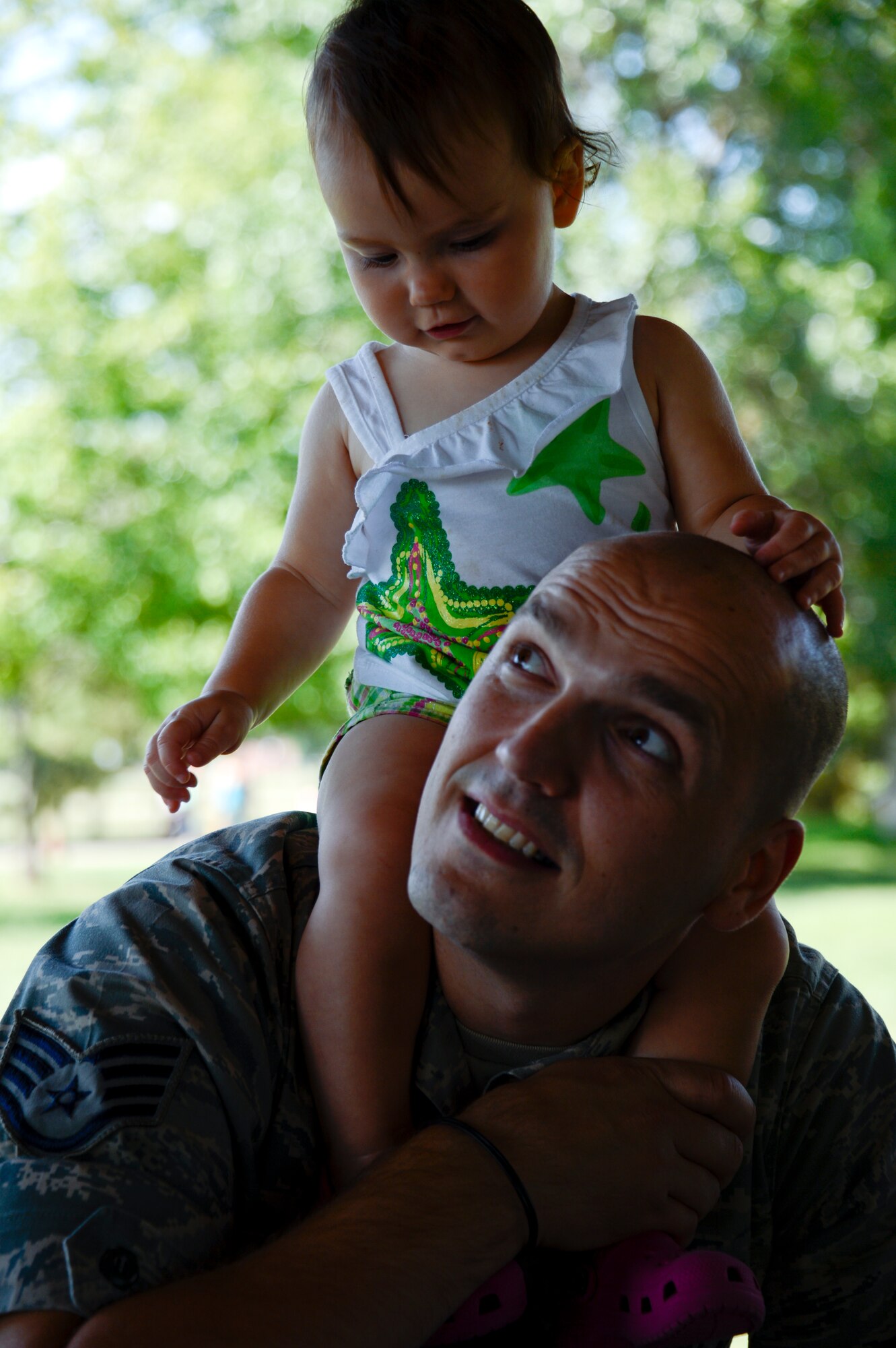 Staff Sgt. Sanel Velic, 133rd Communication Flight, spends the day with his daughter, Mira, at the annual Family Day event in St. Paul, Minn., Aug. 17, 2013.  Family Day is an annual event that recognizes the families and thanks them for their support to the Airmen.
(U.S. Air National Guard photo by Tech. Amy M. Lovgren/Released)
