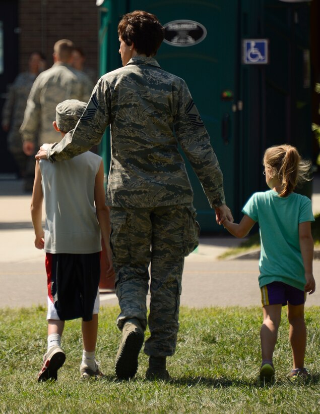 Senior Master Sgt. Kristin Von Eschen, 133rd Airlift Wing, spends the day with her son Luke, left, and daughter Lauren, right, at the annual Family Day event in St. Paul, Minn., Aug. 17, 2013.   Family Day is an annual event that recognizes the families and thanks them for their support to the Airmen.
(U.S. Air National Guard photo by Tech. Amy M. Lovgren/Released)
