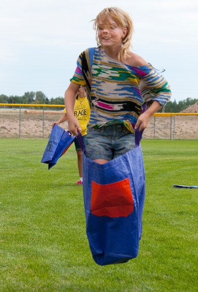 130821-F-JW079-0689
Amanda Winters, 11, competes in the sack race during the annual F.E. Warren Air Force Base, Wyo., Frontiercade Aug. 21, 2013. Frontiercade gives the Airmen of the 90th Missile Wing, and their families, a chance to get together in friendly competition in a wide range of events and games. (U.S. Air Force photo by R.J. Oriez)