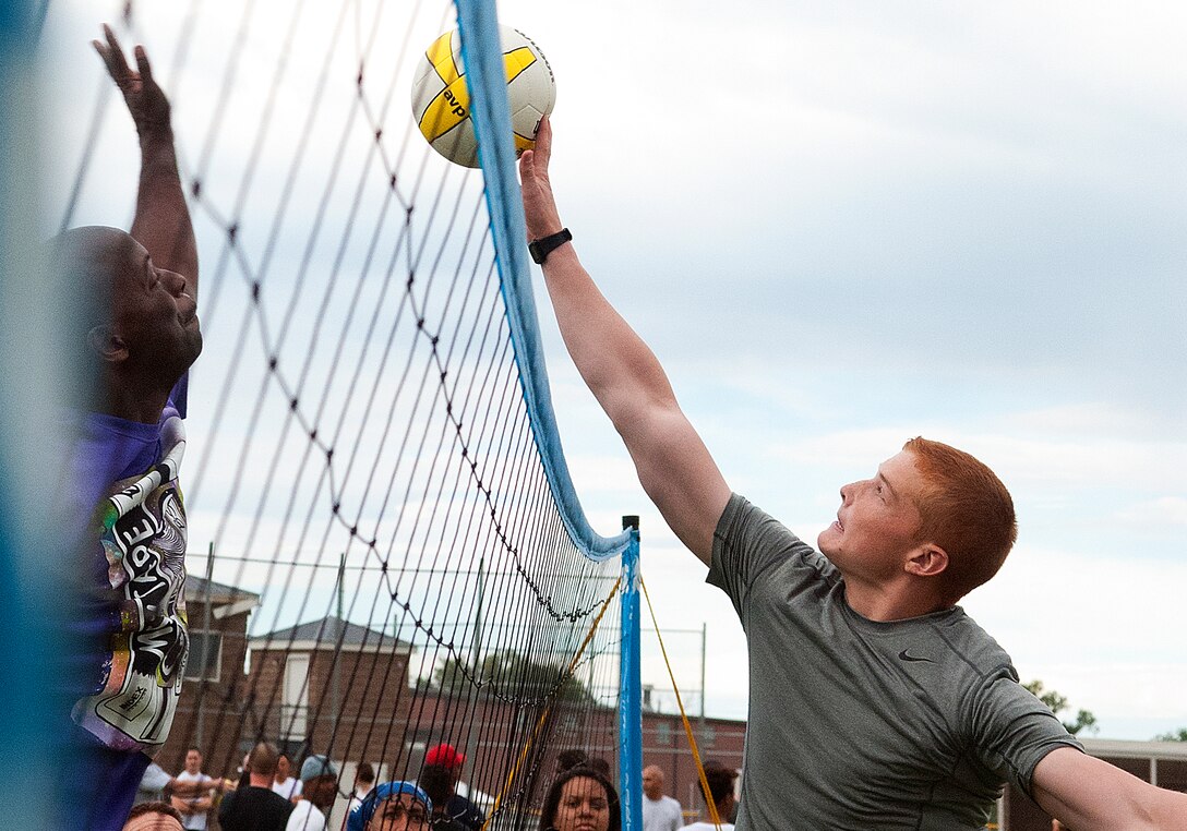 130821-F-JW079-0511
A 90th Communication Squadron volleyball player attempts to spike the ball as a 90th Security Forces Squadron opponent goes for the block during the F.E. Warren Air Force Base, Wyo., Frontiercade Aug. 21, 2013. (U.S. Air Force photo by R.J. Oriez)