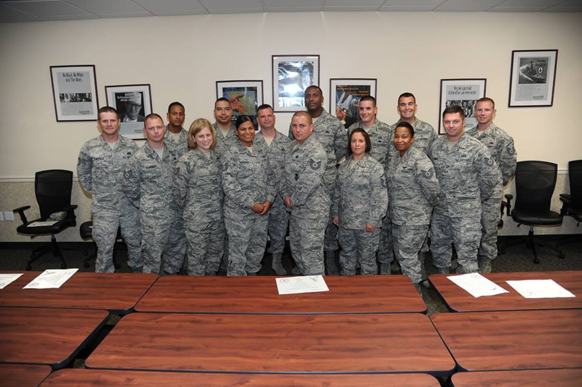 The 16 graduates of the First Sergeants Symposium Graduation pose for a photo after receiving their graduation certificates Aug. 15 at the Airman and Family Readiness Center. The graduates went through a week-long training Aug. 12-15 which gave them the tools to perform the role of a First Sergeant if called upon. The course was instructed by the First Sergeant Council and went over topics such as the Uniform Code of Military Justice, inspections, searches, and taking care of Airmen. (U.S. Air Force Photo/Airman 1st Class Stephanie Englar)