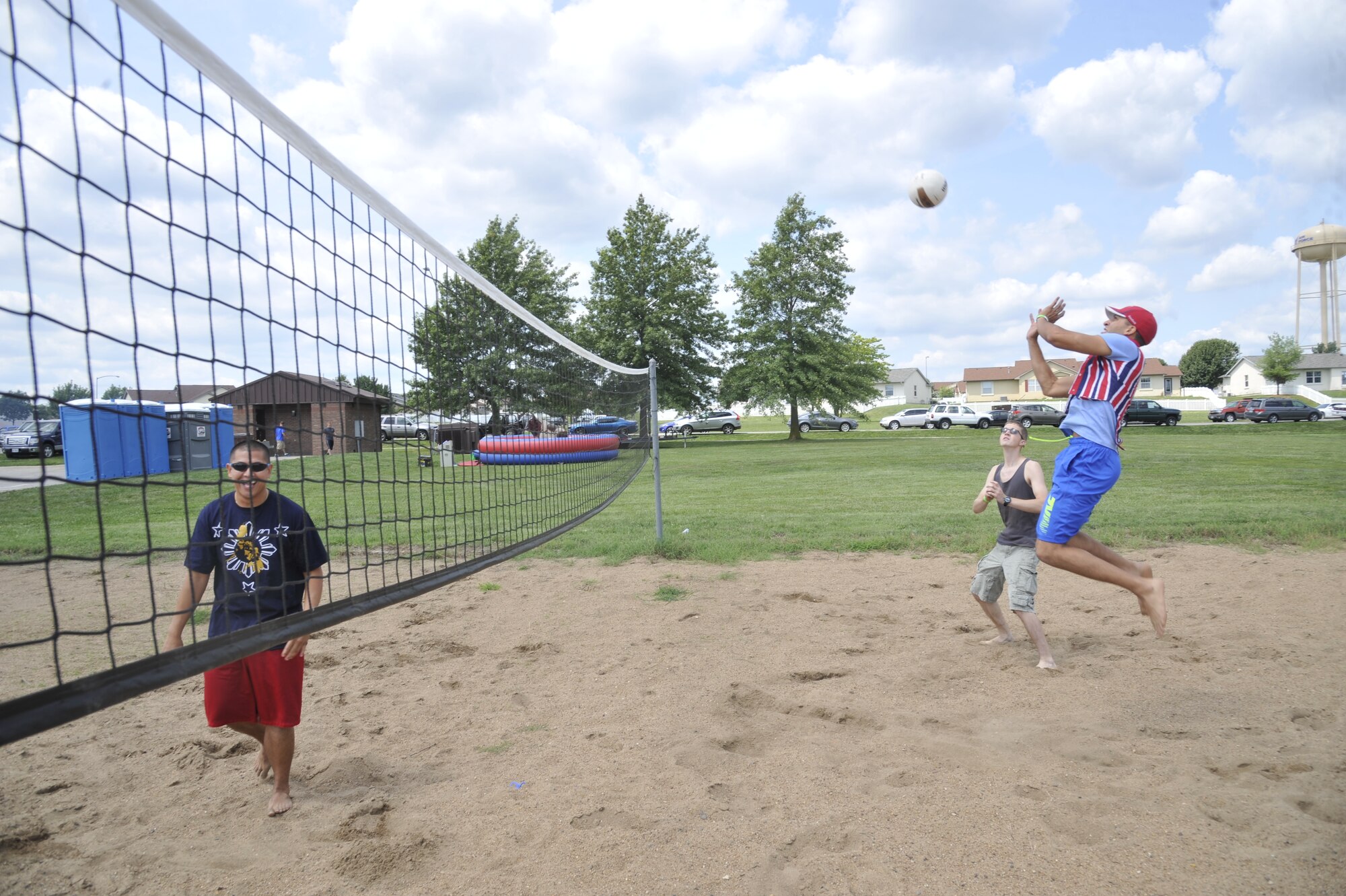 Airmen from the 509th Bomb Wing play volleyball at Whiteman Air Force Base, Mo., Aug. 16, 2013. The Atomic Luau is an exciting event for Airmen, friends and family to enjoy games, music and food. (U.S. Air Force photo by Airman 1st Class Keenan Berry/Released)