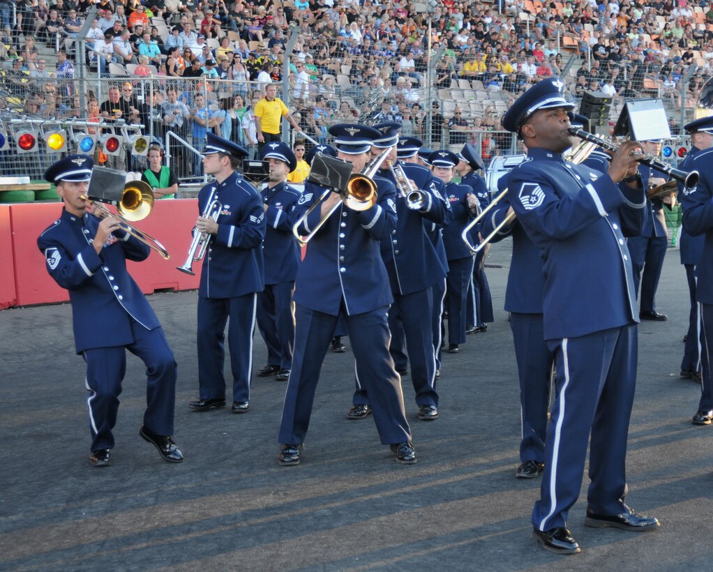 The USAFE Marching Band performs Louis Prima's Big Band favorite "Sing, Sing, Sing" at the 2013 NitrOlympx Drag Racing competition.  The event attracting over 30,000 people was hosted by the USO in Europe.