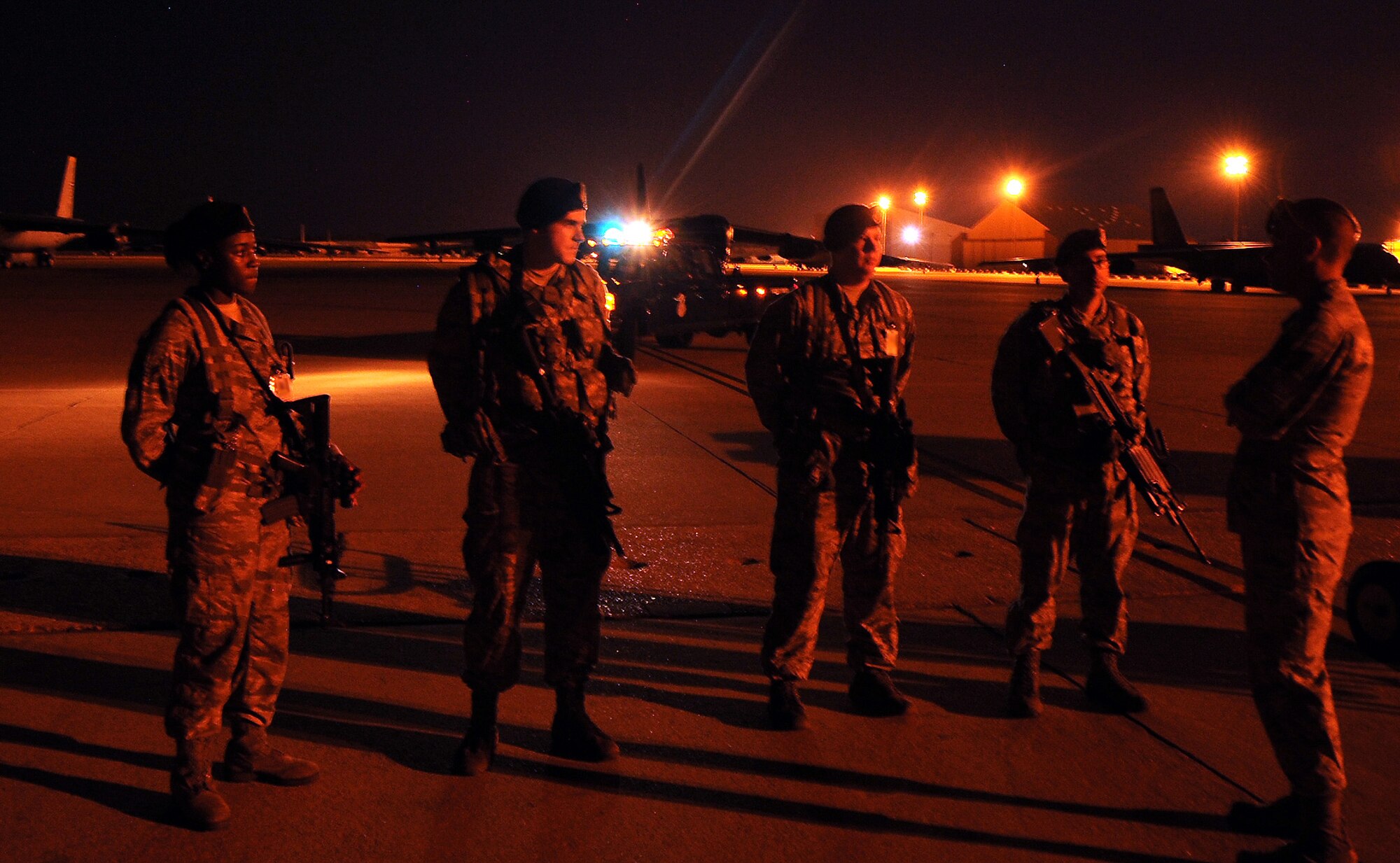 Airmen from the 2nd Security Forces Squadron get feedback after a security exercise on the flightline at Barksdale Air Force Base, La., Aug. 19, 2013. The Air Force mission is 24-hours a day, and 2nd SFS Airmen work shifts round-the-clock to keep the mission protected from threats. (U.S. Air Force photo/Staff Sgt. Jason McCasland) 