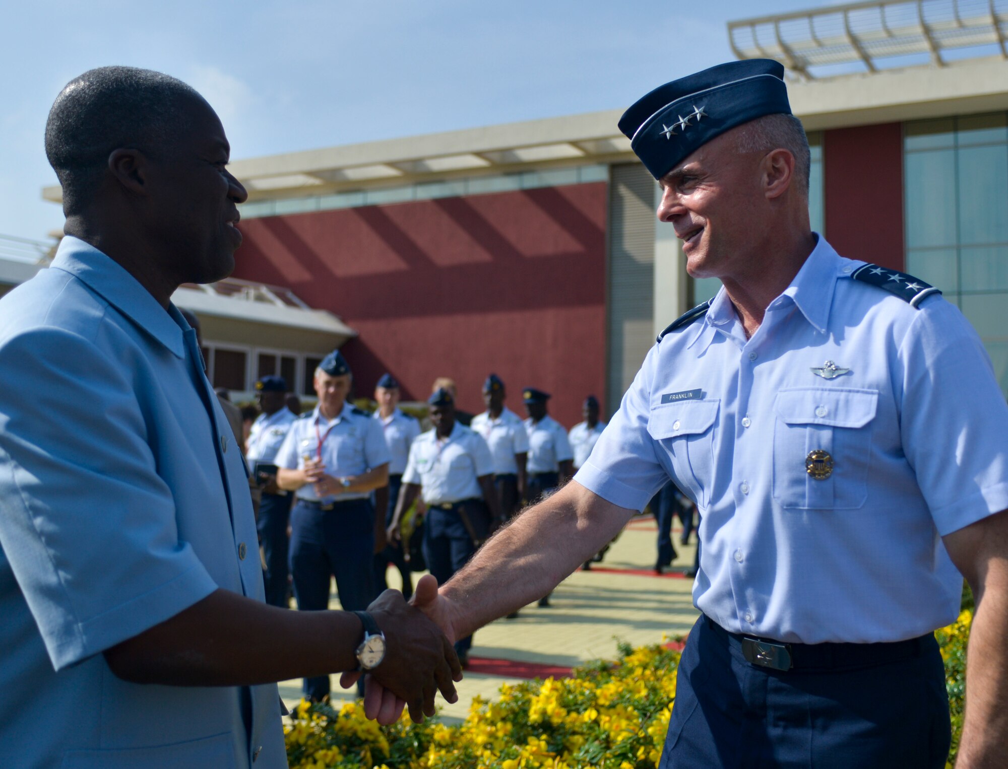 Lt. Gen. Craig A. Franklin, 3rd Air Force commander, shakes hands with Ghanaian vice president Kwesi Amissah-Arthur after their meeting with 10 African air chiefs, Aug. 21, 2013, Accra, Ghana. Franklin and the air chiefs spent three days discussing various ways the air chiefs could collaborate air power resources to address regional challenges during the Regional African Air Chiefs Symposium hosted in Accra. (U.S. Air Force photo by Airman 1st Class Jordan Castelan/Released)