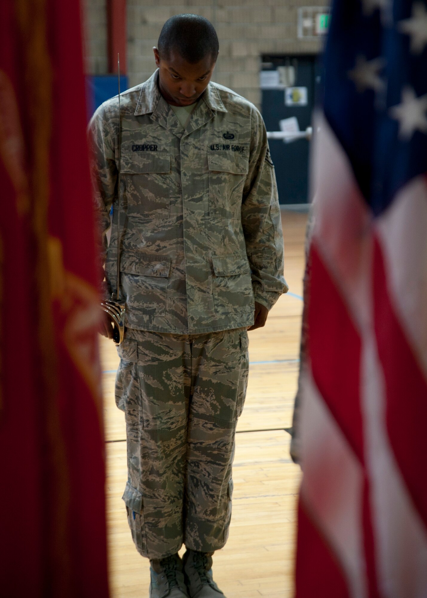 Staff Sgt. Keyone Cropper practices a saber standing manual during a weekly honor guard practice at the 379th Air Expeditionary Wing in Southwest Asia, Aug. 19, 2013. Cropper is a 379th Expeditionary Maintenance Squadron command support staff craftsman deployed from MacDill Air Force Base, Fla., and hails from Mappsville, Va. (U.S. Air Force photo/Senior Airman Bahja J. Jones)  