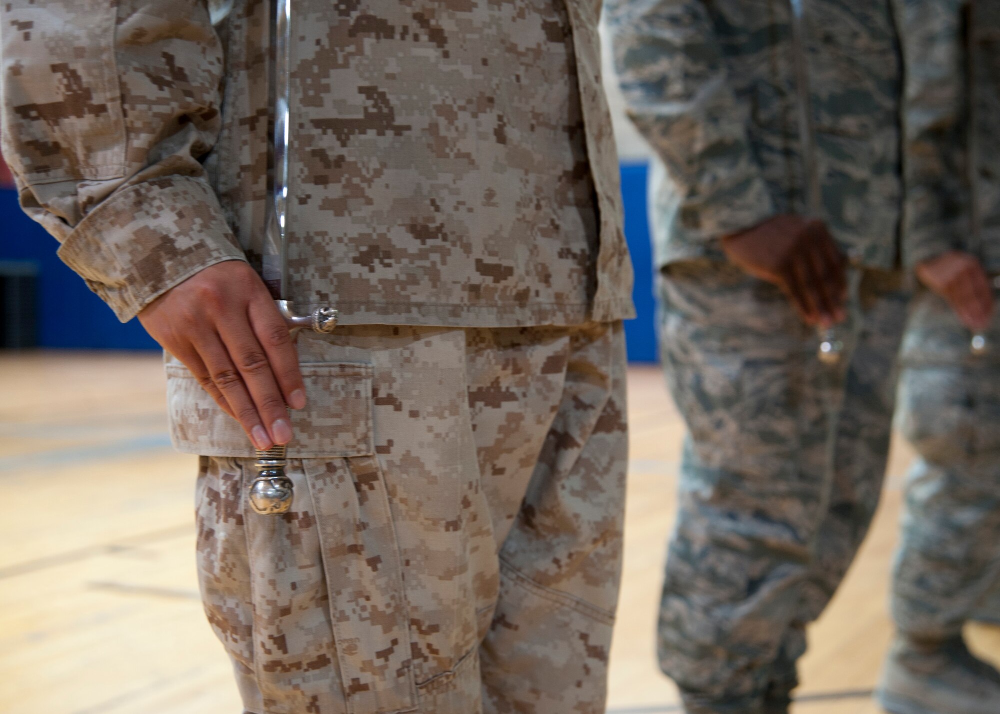 Base honor guardsmen hold their sabers at the position of attention during a weekly practice at the 379th Air Expeditionary Wing in Southwest Asia, Aug. 19, 2013. The base honor guard’s primary tasking is to support unit and morale functions. (U.S. Air Force photo/Senior Airman Bahja J. Jones) 