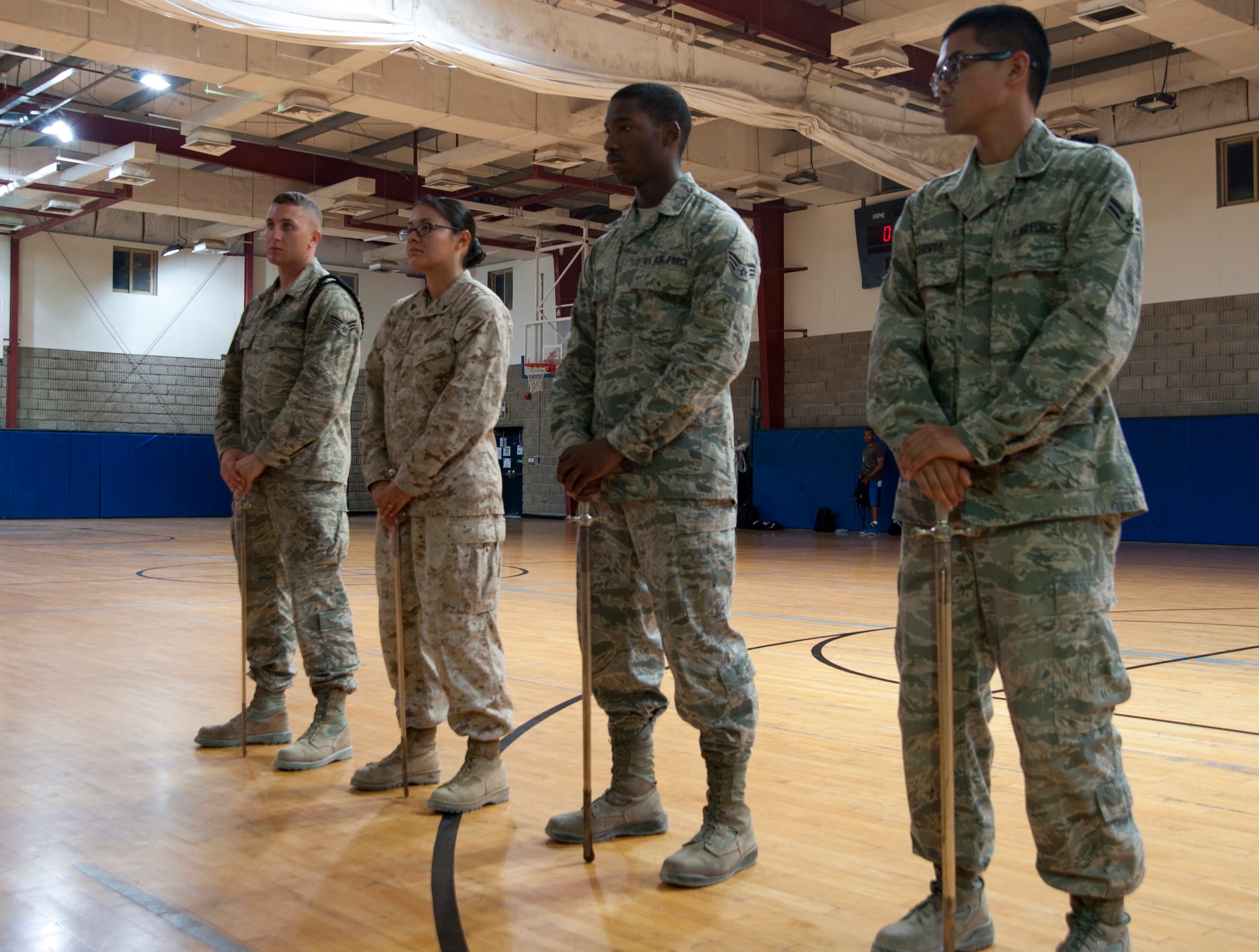 Base honor guardsmen stand ready to learn a new technique during a weekly practice at the 379th Air Expeditionary Wing in Southwest Asia, Aug. 19, 2013. The base honor guard’s primary tasking is to support unit and morale functions. (U.S. Air Force photo/Senior Airman Bahja J. Jones) 