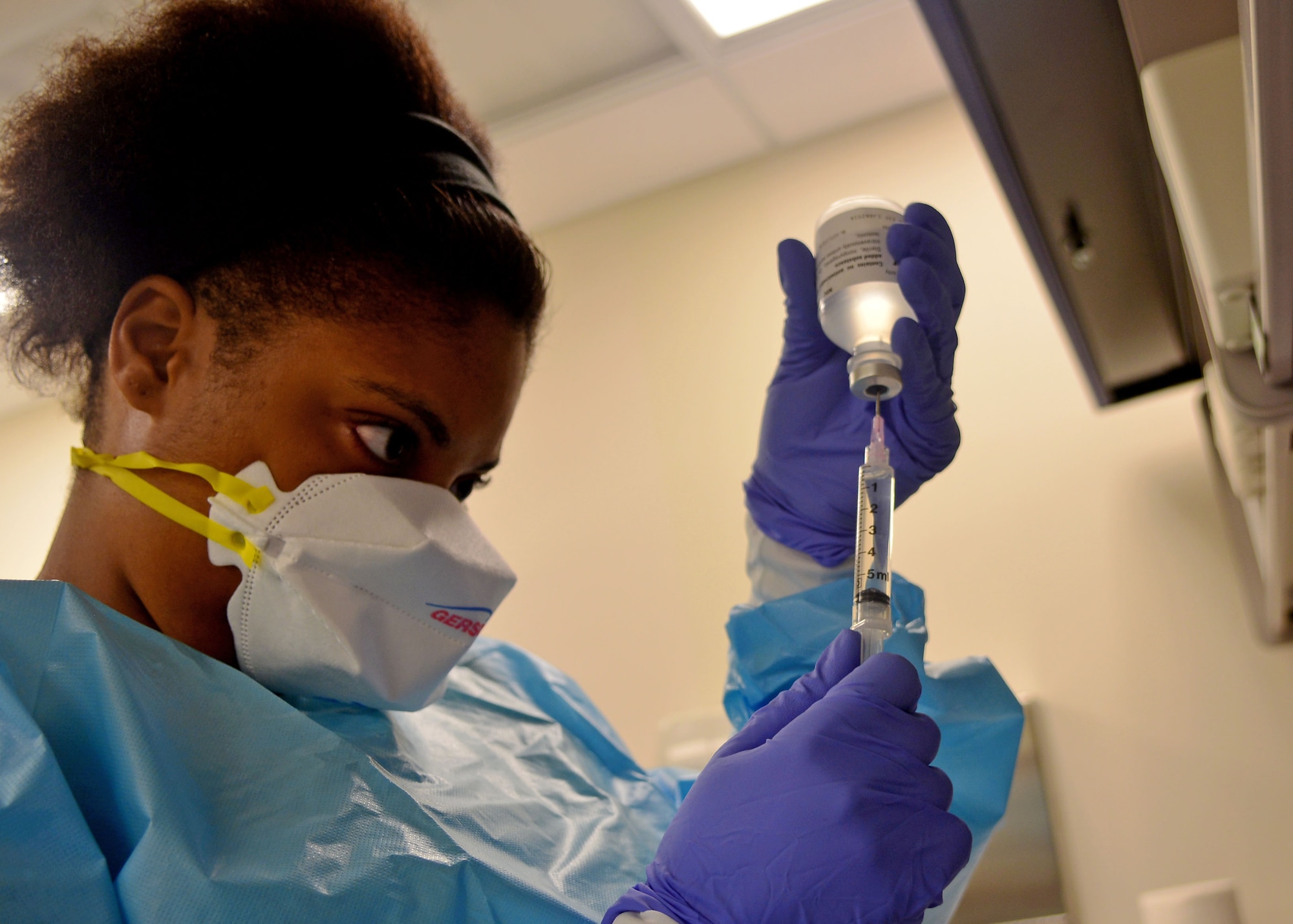 Senior Airman Dominique Arroyo, 31st Medical Support Squadron pharmacy technician, draws sterile water, Aug. 21, 2013, at Aviano Air Base, Italy. MDSS Airmen are responsible for report of surveys, maintaining medical computer programs, ordering medical supplies and managing the 31st Medical Group facility. (U.S. Air Force photo/Airman 1st Class Briana Jones)
