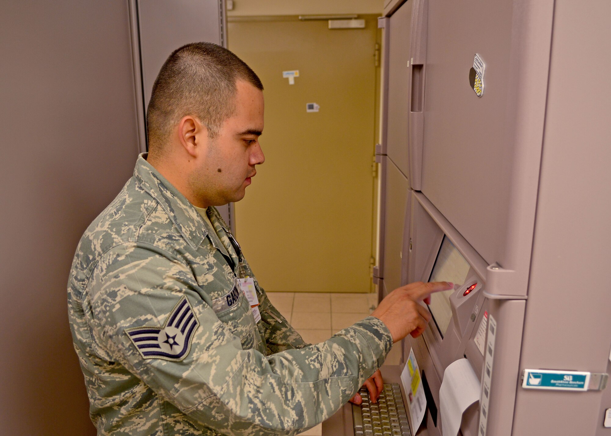 Staff Sgt. Juan Garzon, 31st Medical Support Squadron pharmacy logistics NCO in charge, prints out prescription information, Aug. 21, 2013, at Aviano Air Base, Italy. The pharmacy takes care of inpatient and outpatient services and also restocks and orders medication while supporting medical providers. (U.S. Air Force photo/Airman 1st Class Briana Jones)