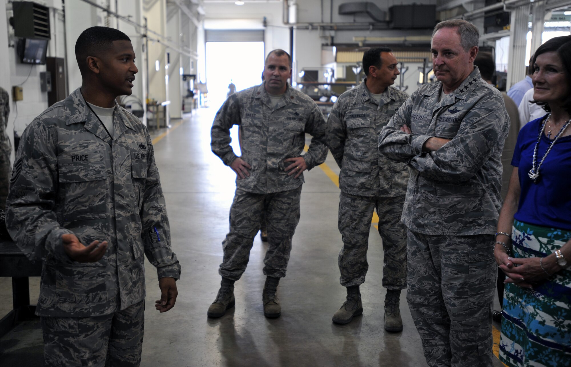 Staff Sgt. Marquette Price, 51st Munitions Squadron aircraft armament systems and weapons technician, briefs Air Force Chief of Staff Gen. Mark A. Welsh III at Osan Air Base, Republic of Korea, Aug. 22, 2013. Welsh and Chief Master Sgt. of the Air Force James A. Cody visited the base to discuss Air Force priorities and to see Team Osan’s mission firsthand. (U.S. Air Force photo/Senior Airman Siuta B. Ika)