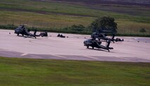 KUNSAN AIR BASE, Republic of Korea -- Soldiers from the 4th Aerial Reconnaissance Battalion (Attack), 2nd Aviation Regiment, Camp Humphreys, Republic of Korea, refuel and re-arm their AH-64 Apache Longbows at Kunsan Air Base, ROK, Aug. 15, 2013. The apaches conducted live-fire training at Jik-Do Island, a nearby training range. (U.S. Air Force photo by Senior Airman Armando A. Schwier-Morales/ Released)