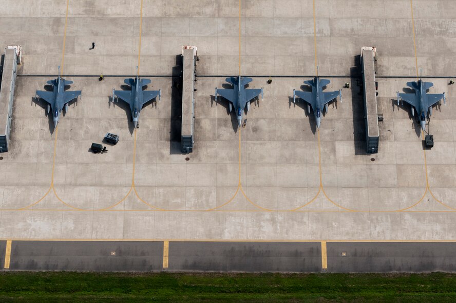 KUNSAN AIR BASE, Republic of Korea -- Maintainers from the 8th Fighter Wing prepare F-16 Fighting Falcons for training flights Aug. 15, 2013. Being ready at all times ensures Airmen are able to complete the Wolf Pack mission. (U.S. Air Force photo by Senior Airman Armando A. Schwier-Morales/ Released)