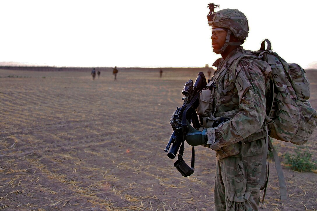 U.S. Army Pfc. Koree Pereira scans to the north while on an early ...