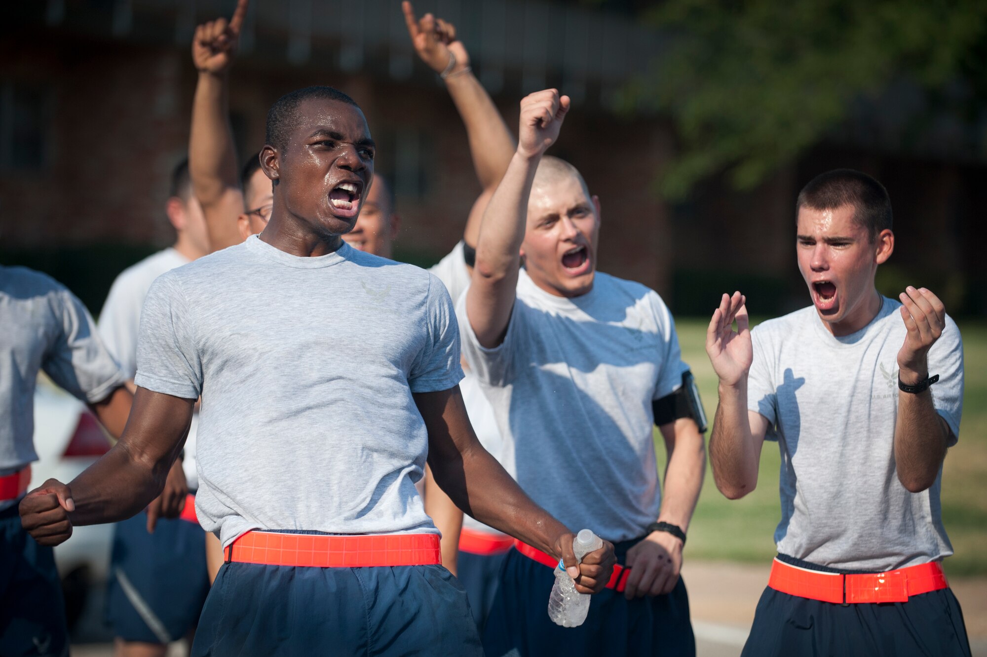 Airmen in training at Sheppard Air Force Base, Texas, were the last impression Hotter'N Hell Hundred riders had on their way out of the base Aug. 24, 2013. After "Airpower Alley" and a rest stop, bicycle riders rode through a gauntlet of hundreds of Airmen screaming and cheering them on to the finish line. As part of the event, hundreds of Sheppard volunteers helped riders needing a break at the last rest stop before the finish line. Across all the rest stops, riders consumed more than 20,000 bananas, more than 9,000 oranges, more than 8,000 pickles, 2,800 gallons of PowerAde and 10,000 gallons of water. In all, more than 70,000 pounds of ice was also used. The annual race is in its 32 year and celebrates to founding members of Texoma with a 100-mile race in 100-degree temperatures. (U.S. Air Force photo/Staff Sgt. Mike Meares)