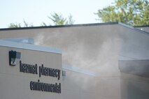 Smoke flowed from the front door of the Hazmat Pharmacy Environmental building during a bomb exercise at Truax Field, Madison, Wis., Aug. 23, 2013. The EOD team added realism by filling that building up with smoke, giving the rescue teams a challenge when removing the victims. The exercise was part of a new Air Force Inspection System initiative. (Air National Guard photo by Senior Airman Andrea F. Liechti)