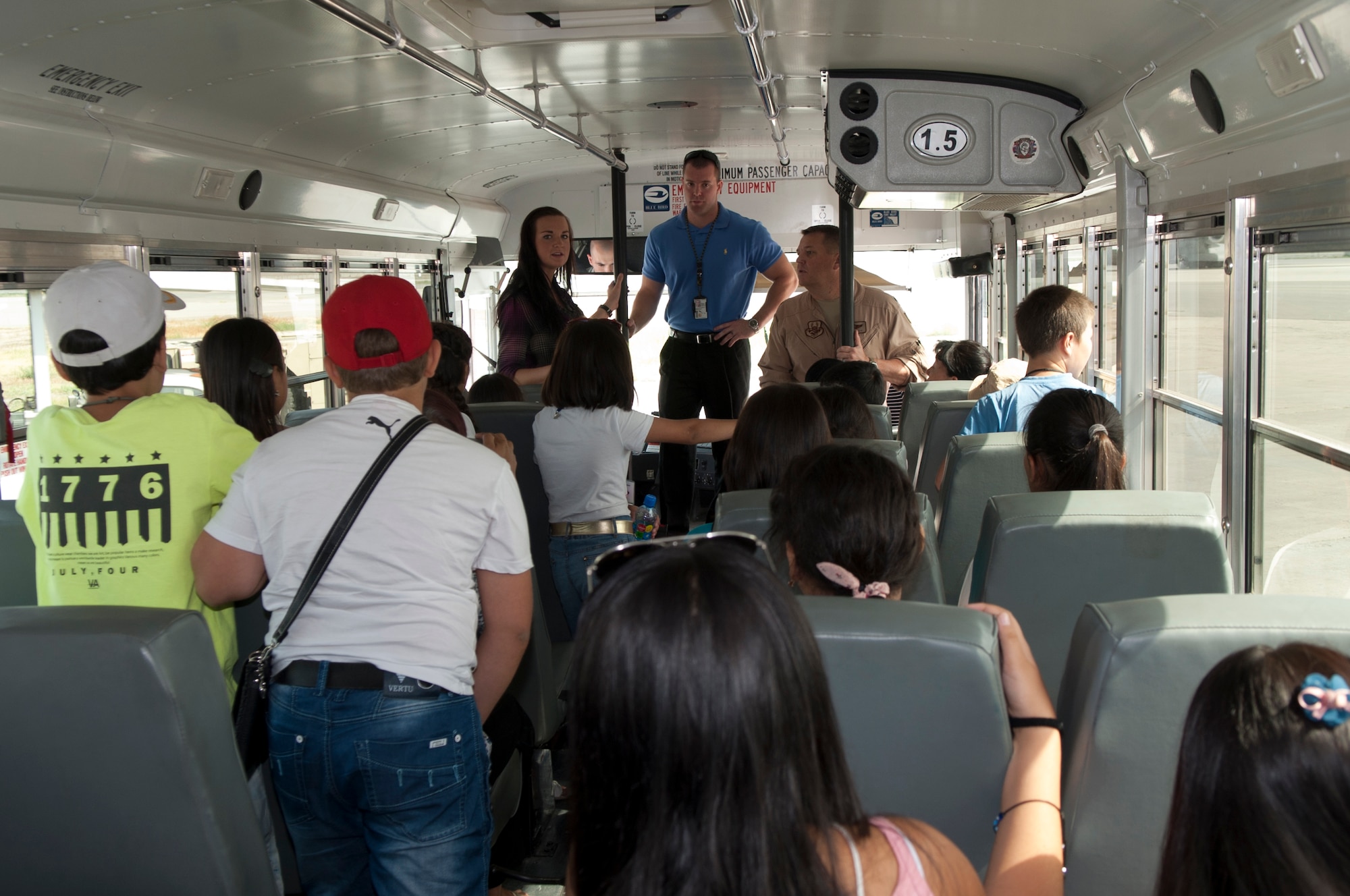 2nd Lt. Liya Smolina translates flightline safety rules to visiting Kyrgyz students at Transit Center at Manas, Kyrgyzstan, August 22, 2013. Smolina is deployed out of Tyndall Air Force Base, Fla., and is a native of Honolulu, Hawaii. (U.S. Air Force photo/Staff Sgt. Robert Barnett)