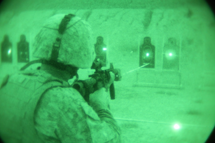 2nd Lt. David Denisi sights-in on his target using night vision goggles and an advanced target pointer illuminator aiming light during an intermediate combat rifle marksmanship course of fire Aug. 13 at Range 13 near Camp Schwab. The training is built around combat-oriented shooting with the goal of familiarizing Marines with engaging targets while subjected to combat limitations, such as low to no-light conditions. Denisi is an operations assistant with 3rd Maintenance Battalion, Combat Logistics Regiment 35, 3rd Marine Logistics Group, III Marine Expeditionary Force.
