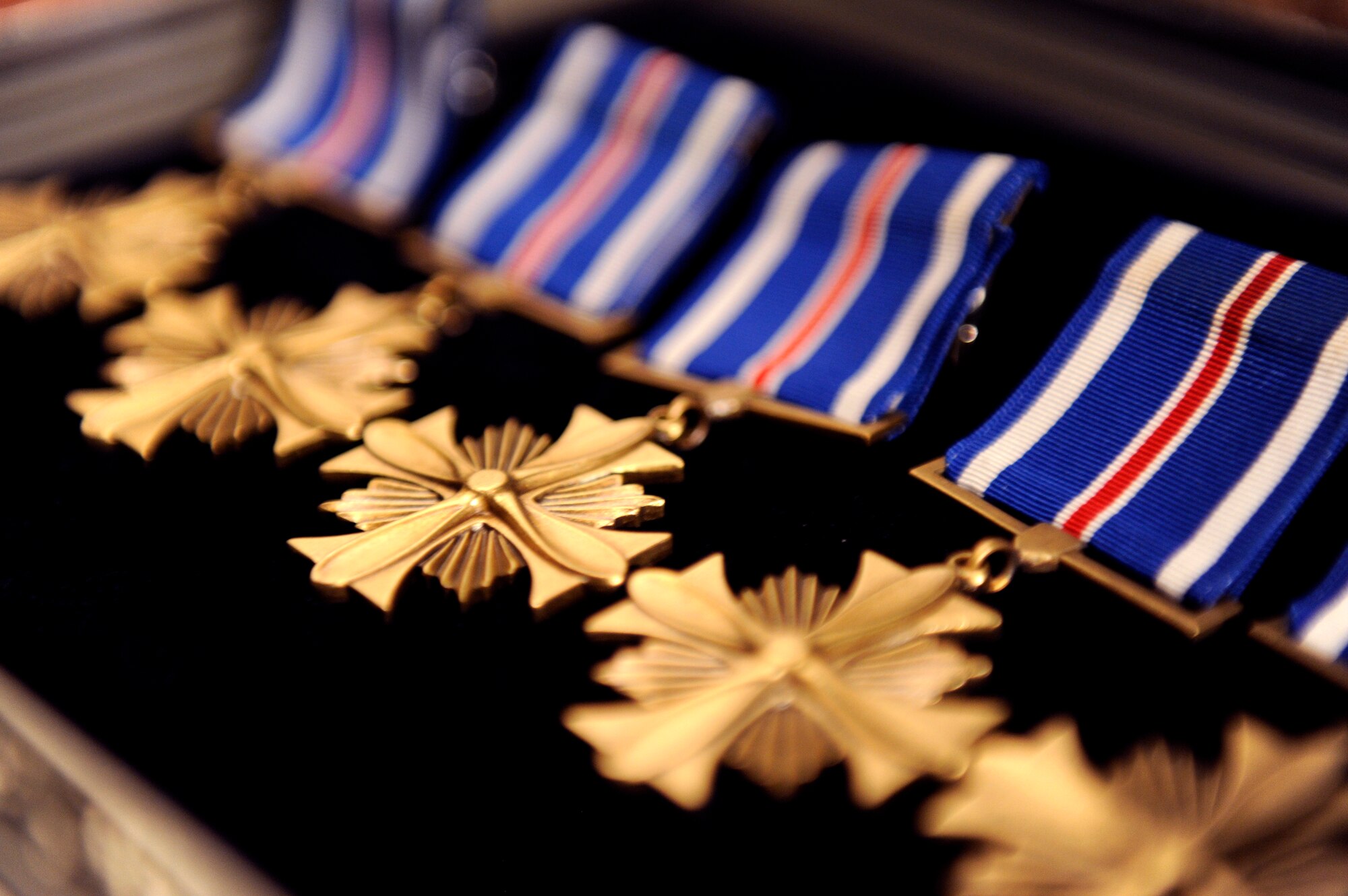 Five U.S. Air Force Distinguished Flying Crosses with valor are set out to be awarded to Airmen by Air Force Chief of Staff Gen. Mark A. Welsh III during the general’s visit to Kadena Air Base, Japan, Aug. 21, 2013.  During their visit to Kadena, Welsh and Chief Master Sgt. of the Air Force James Cody visited several units around the base and hosted an Airman’s call with 18th Wing Airmen, where they awarded five Distinguished Flying Crosses with valor. Welsh and Cody visited Kadena as part of a two-week visit to the region to thank Airmen and their families and discuss challenges and opportunities in the Pacific. (U.S. Air Force photo by Senior Airman Maeson L. Elleman)