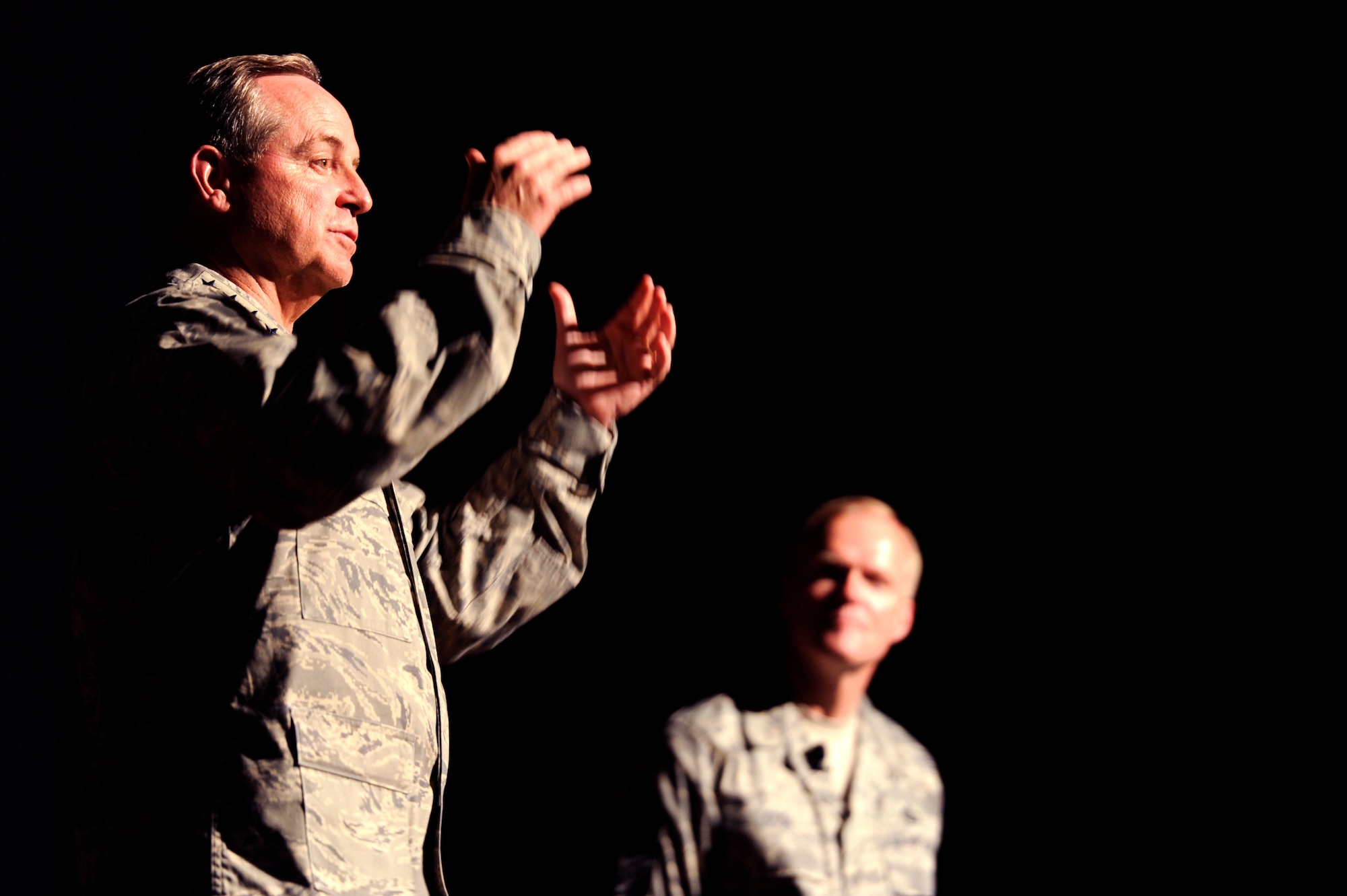 Air Force Chief of Staff Gen. Mark A. Welsh III talks to 18th Wing Airmen and Chief Master Sgt. of the Air Force James Cody listens during an Airman’s call on Kadena Air Base, Japan, Aug. 21, 2013. During their visit to Kadena, Welsh and Cody visited several units around the base and hosted an Airman’s call with 18th Wing Airmen, where they awarded five Distinguished Flying Crosses with valor. Welsh and Cody visited Kadena as part of a two-week visit to the region to thank Airmen and their families and discuss challenges and opportunities in the Pacific. (U.S. Air Force photo by Senior Airman Maeson L. Elleman/Released)