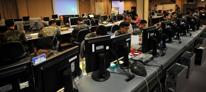 U.S. and Republic of Korea Airmen, Soldiers and Sailors, work together at the Korean Air Simulation Center during Ulchi Freedom Guardian 2013 at Osan Air Base, Republic of Korea, Aug. 22, 2013. The annual exercise, conducted by the ROK and U.S. Combined Forces Command, runs through Aug. 30. (U.S. Air Force photo/Staff Sgt. Emerson Nuñez)