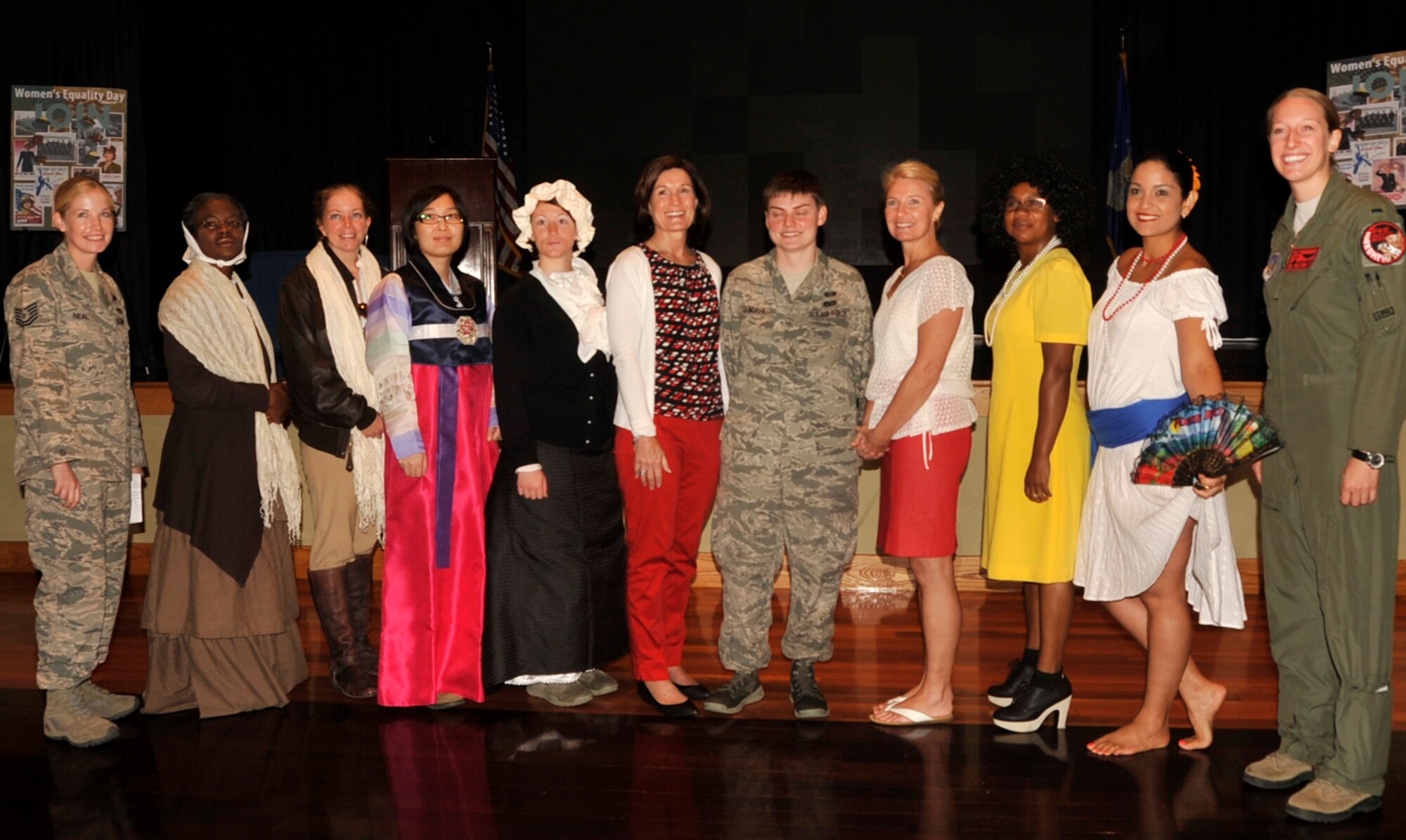 Betty Welsh, wife of Air Force Chief of Staff Gen. Mark A. Welsh III, and Athena Cody, wife of Chief Master Sgt. of the Air Force James A. Cody, gather for a group photo while attending a Women’s Equality Day event while visiting Osan Air Base, Republic of Korea, Aug. 23, 2013. Welsh and Cody visited Osan to meet with Airmen and their families to better understand the unique circumstances they  face while stationed at the Air Force’s most forward deployed permanently assigned Air Base.  (U.S. Air Force Photo/Tech. Sgt. Micky M. Bazaldua)