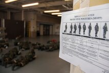 After donning their chemical gear, Airmen from the 419th Medical Squadron lay on the ground during a readiness exercise here this weekend. Airmen add and remove parts of their chemical gear depending on the threat level. In a deployed location, they must put on gas masks, the most critical part of chemical gear, within seconds of an attack. (U.S. Air Force photo/Senior Airman Crystal Charriere)
