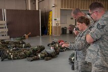 Senior Master Sgt. Jason Reininger, Tech. Sgt. Heather Nevius, and Staff Sgt. Matthew Plendl (front left to right), of the 419th Medical Squadron, evaluate reservists’ reactions to changing alarm conditions and mission-oriented protective postures during an exercise here this weekend. Medical personnel tested their skills to ensure they‘re prepared to do their jobs in a hostile environment.

“As medics, we excel during emergencies,” Reininger said. “The ambulance teams were quick to identify patient injuries and apply successful treatment. Everyone worked as a team to complete the mission and carry out solutions to problems.”

(U.S. Air Force photo/Senior Airman Crystal Charriere)

