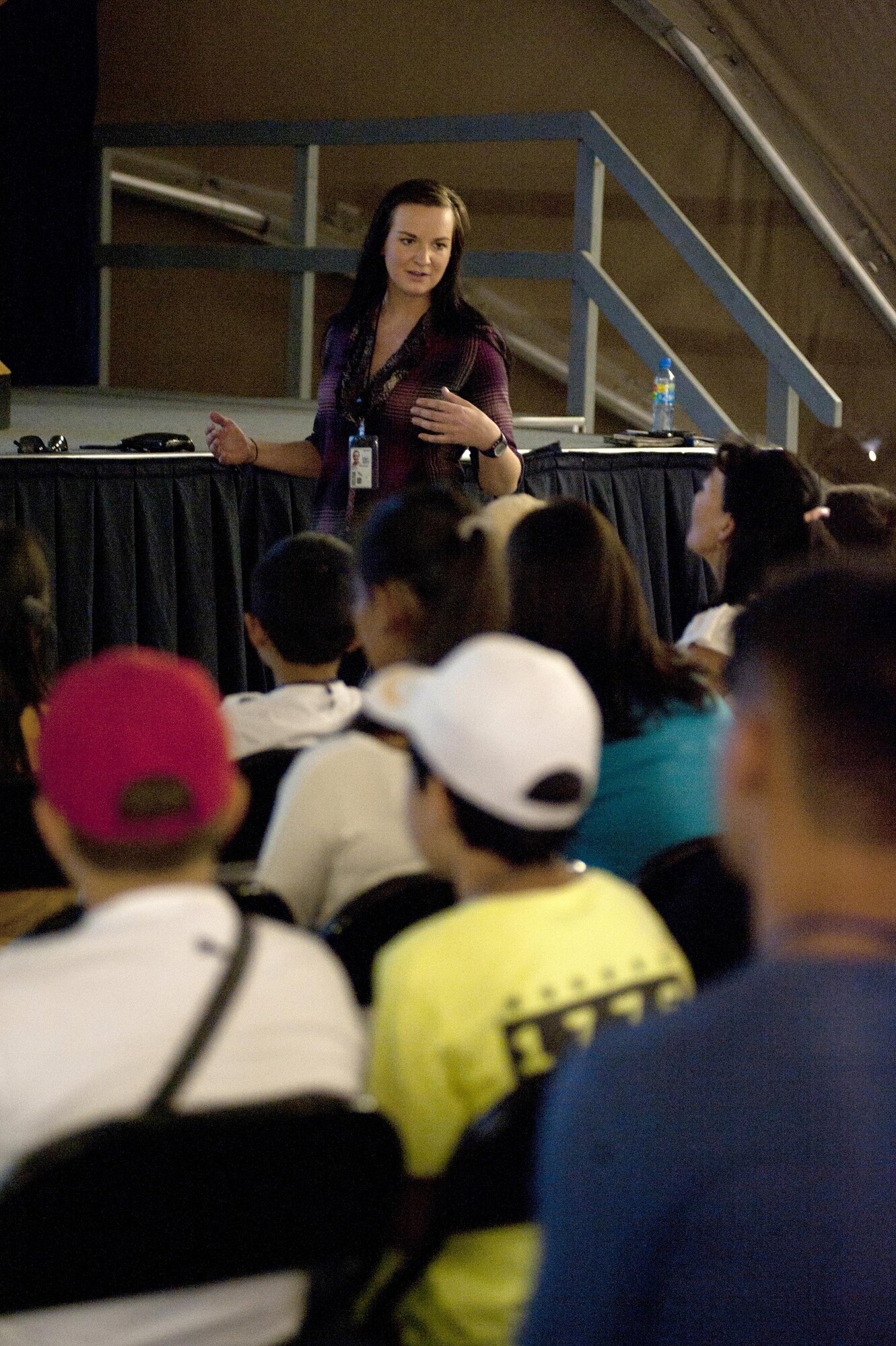 2nd Lt. Liya Smolina explains the four pillars mission to visiting Kyrgyz students at Transit Center at Manas, Kyrgyzstan, August 22, 2013. Smolina is an interpreter assigned to 376th Theater Security Cooperation. 