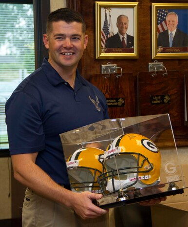 Recruiting Station Milwaukee said farewell to Capt. Nicholas Borns, the outgoing Executive Officer, with a surprise – a signed helmet from his favorite team, the Green Bay Packers.  Capt. Borns will attend a career course in Fort Lee, Va., before moving on to his next duty station. 