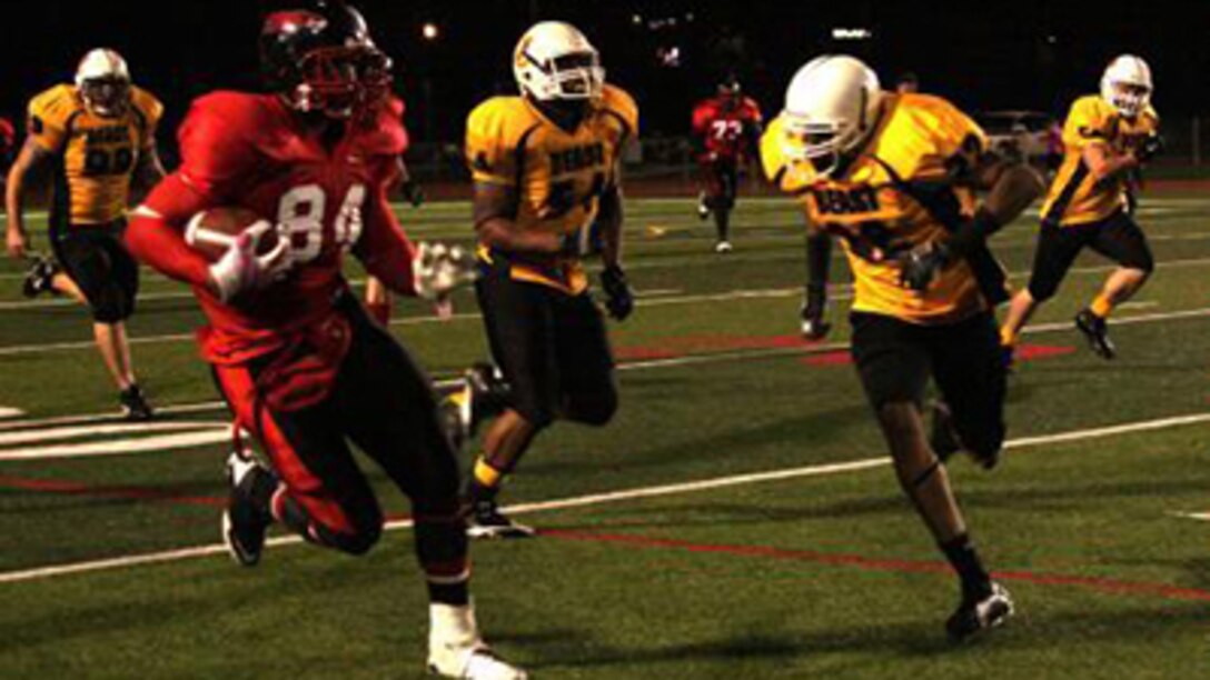 Cpl. Steven Rhodes, a wide receiver with the Marine Corps Air Station Miramar Falcons and an Antioch, Tenn., native, runs down the field during a Camp Pendleton Football League Championship playoff game against the 1st Marine Logistics Group Beasts at the Paige Field House Football Field aboard Marine Corps Base Camp Pendleton, Calif., Nov. 20, 2012. Rhodes helped the Falcons win second place in the Camp Pendleton Football League Championship.