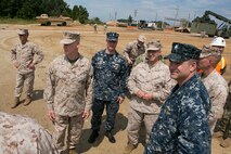 Lt. Gen. Richard T. Tryon, Commander, U.S. Marine Corps Forces Command (MARFORCOM) discusses joint training and operations aboard Joint Expeditionary Base Little Creek, Aug. 21. The Camp Lejeune based Marine Corps Combat Logistics Battalion 24 partnered with the Navy to practice loading logistical supplies aboard ships simulating disaster relief efforts. The training is aimed at improving response time in the event of an actual crisis.