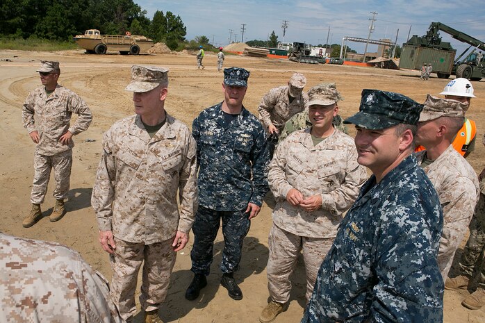 Lt. Gen. Richard T. Tryon, Commander, U.S. Marine Corps Forces Command (MARFORCOM) discusses joint training and operations aboard Joint Expeditionary Base Little Creek, Aug. 21. The Camp Lejeune based Marine Corps Combat Logistics Battalion 24 partnered with the Navy to practice loading logistical supplies aboard ships simulating disaster relief efforts. The training is aimed at improving response time in the event of an actual crisis.
