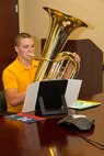 Oscar Donegan rehearses “His Majesty the Tuba” in preparation for a phone audition to see if he can qualify for the Musician Enlistment Option Program.  Musicians must pass an audition with the Marine band placement director in order to be considered for the program.  They are evaluated on their performance in various categories including sight reading, scales and prepared material.