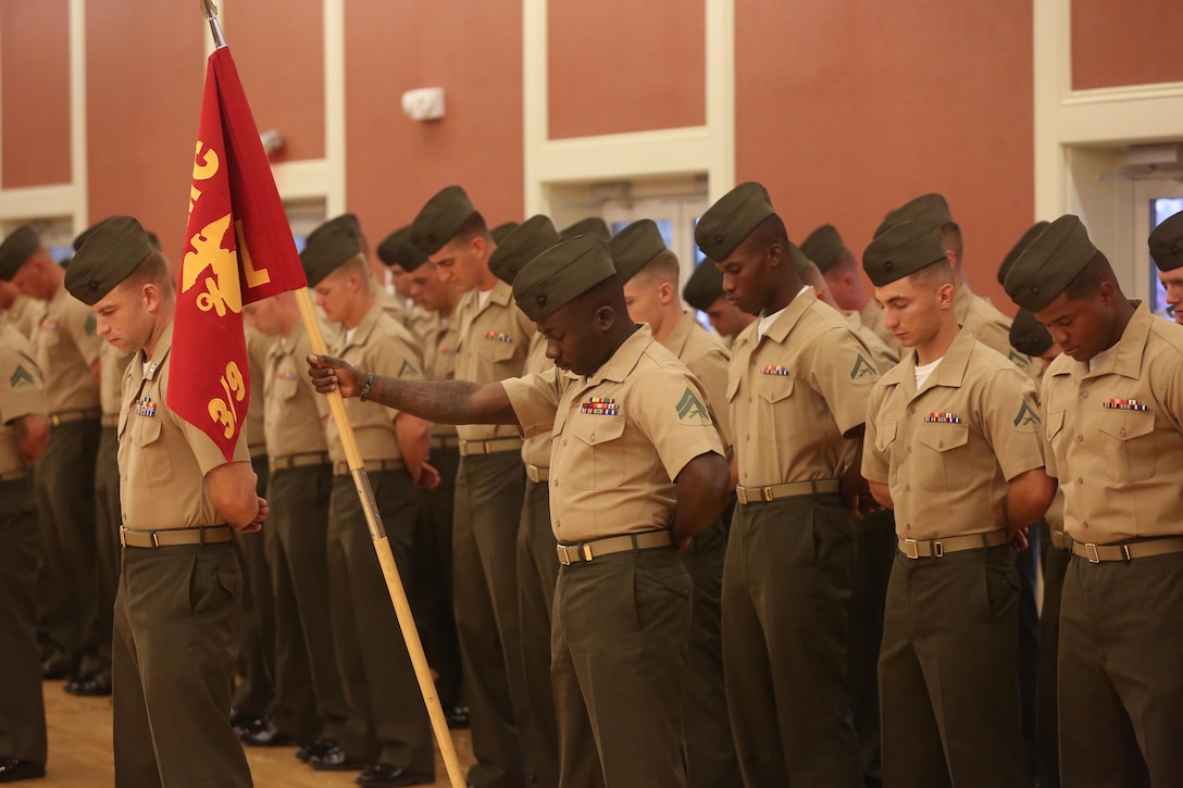 Marines with 3rd Battalion, 9th Marine Regiment, bow their heads during a prayer Aug. 13, 2013 during the battalion's deactivation ceremony aboard Marine Corps Base Camp Lejeune. This ceremony marked the fifth time the battalion has been deactivated since its origination in 1917.