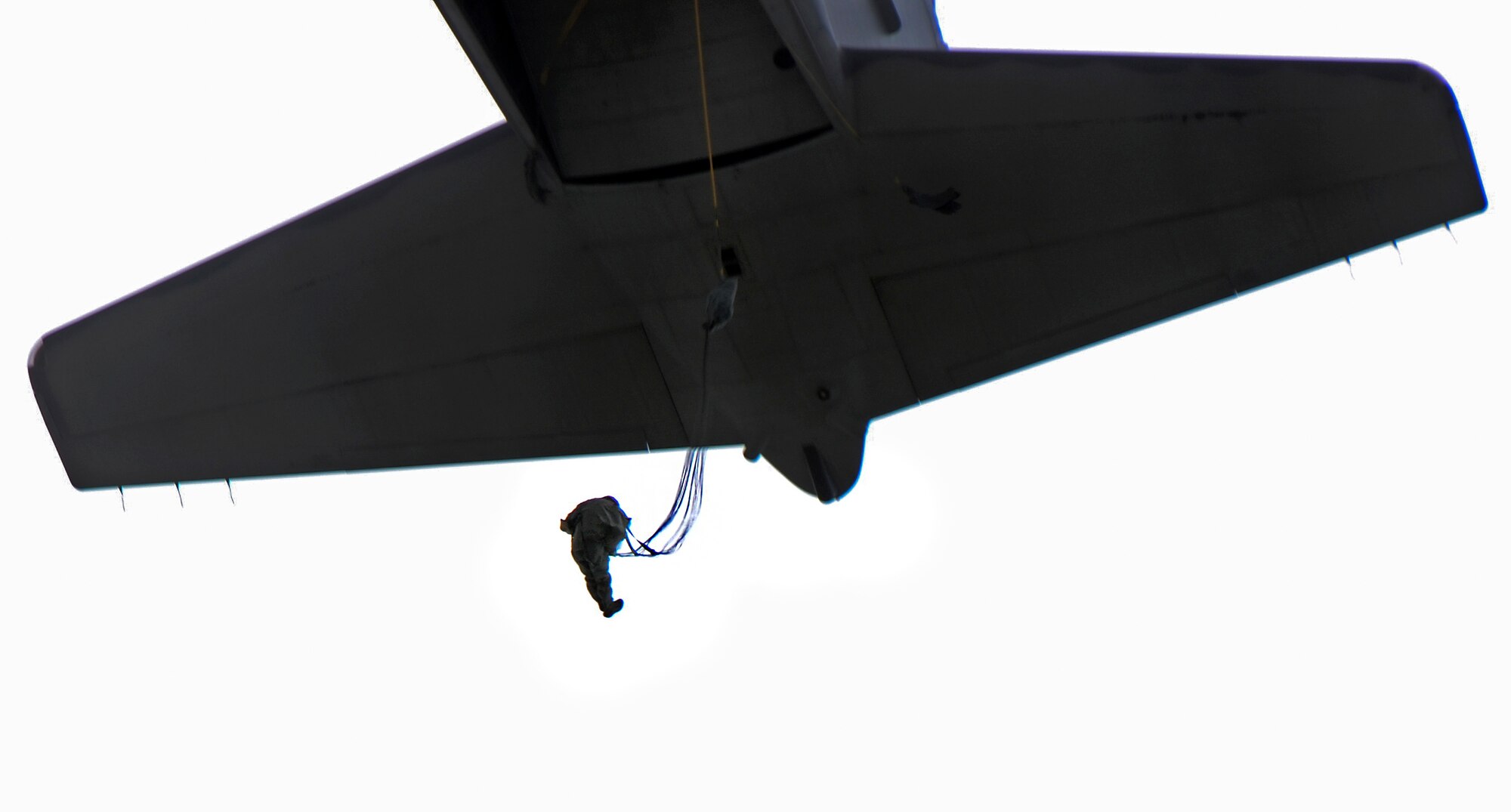 A member of the 736th Security Forces Squadron jump from a C-130 Hercules Aug. 21, 2013, during a static line jump training over Andersen Air Force Base, Guam. As the integrated force protection element of the 36th Contingency Response Group, members of the 736th SFS provide a quick-response airborne capability that serves as an advance echelon team for contingency and humanitarian missions all over the Asia-Pacific region
