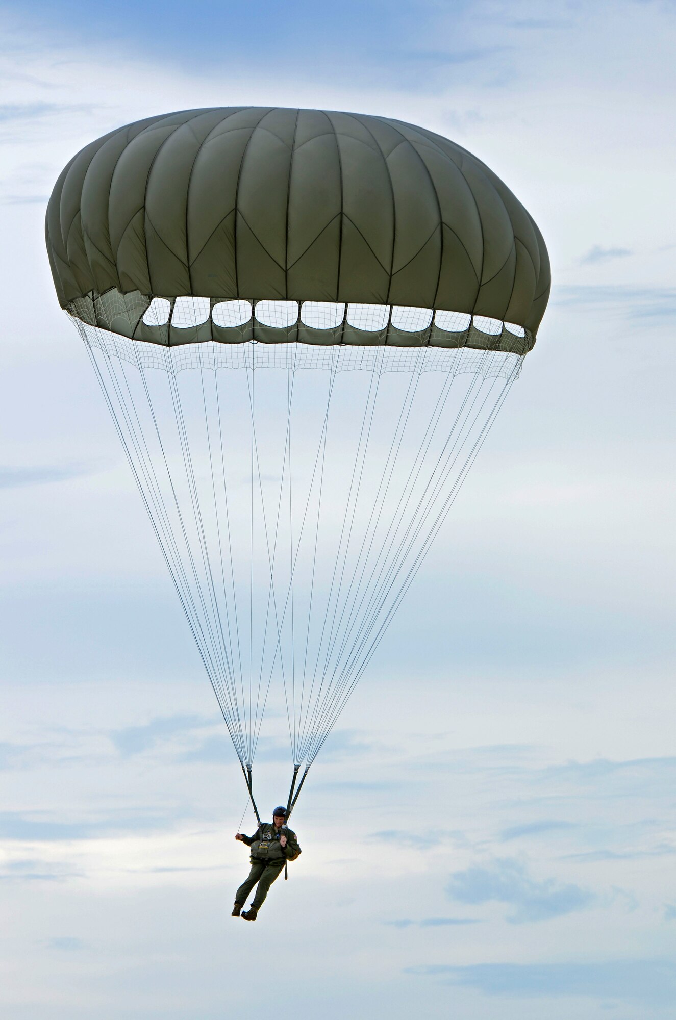 Staff Sgt. Daniel Guy, 736th Security Forces Squadron fire team leader, makes his way to the ground Aug. 21 after jumping from a C-130 Hercules over Andersen Air Force Base, Guam. Air Force static line capability falls under the personnel parachute program. Jumpers are first qualified during a three-week long basic airborne course at Ft. Benning, Ga., and then continue to work on their jumping proficiency and qualifications after they return here.