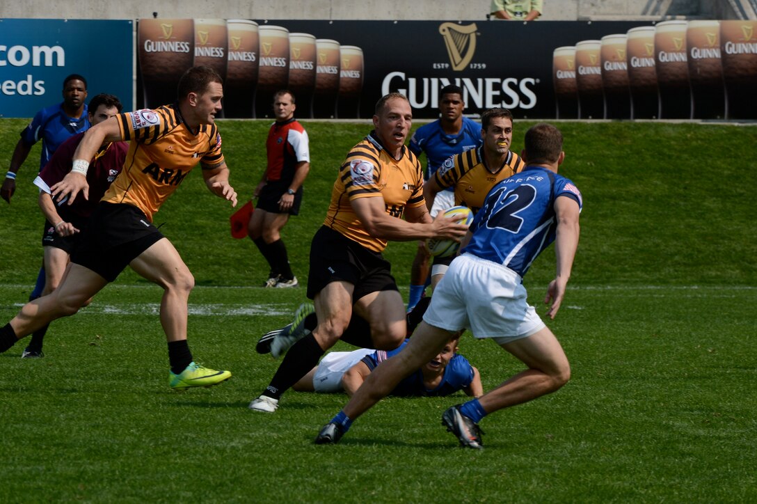 Maj. Nate Conkey of Joint Base Lewis-McChord, Wash., scores the first try for All-Army during the Soldiers' 26-7 victory over All-Air Force in the teams' first meeting of the 2013 Armed Forces Rugby Championships, Aug. 16, 2013, at Infinity Park in Glendale, CO