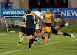 Maj. Nate Conkey of Joint Base Lewis-McChord, Wash., via Falls Church, Va., sets the defensive tone for All-Army during the Soldiers' 19-14 victory over All-Air Force in the gold-medal game of the 2013 Armed Forces Rugby Championships on Aug. 17 at Infinity Park in Glendale, Colo. U.S. Army photo by Tim Hipps, IMCOM Public Affairs