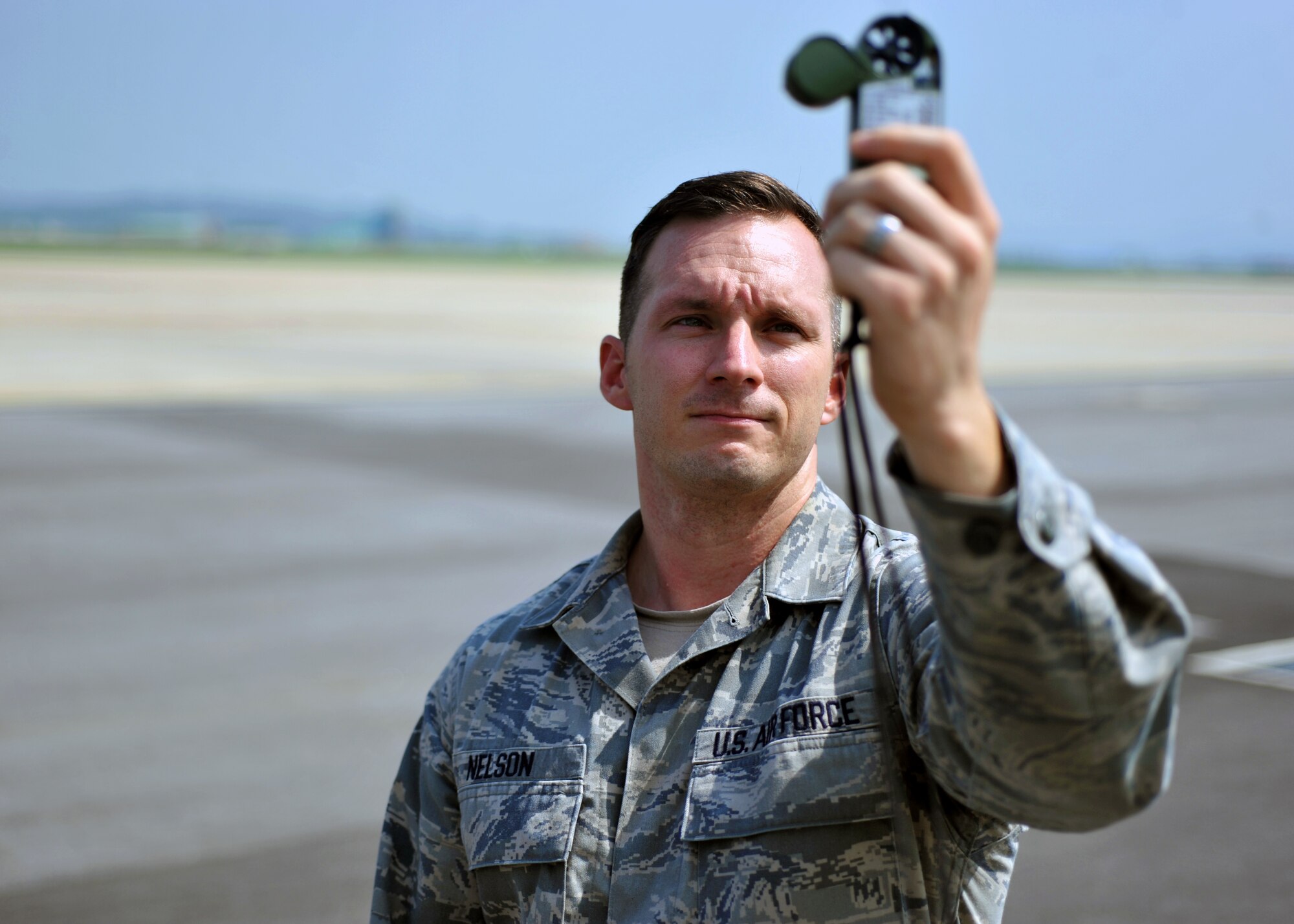Staff Sgt. Michael Nelson, 51st Operations Support Squadron mission weather element NCO in charge, uses a portable weather tracker on the flight line at Osan Air Base, Republic of Korea, August 20, 2013. Nelson is this week’s Airman Spotlight winner. (U.S. Air Force photo/Senior Airman Siuta B. Ika)