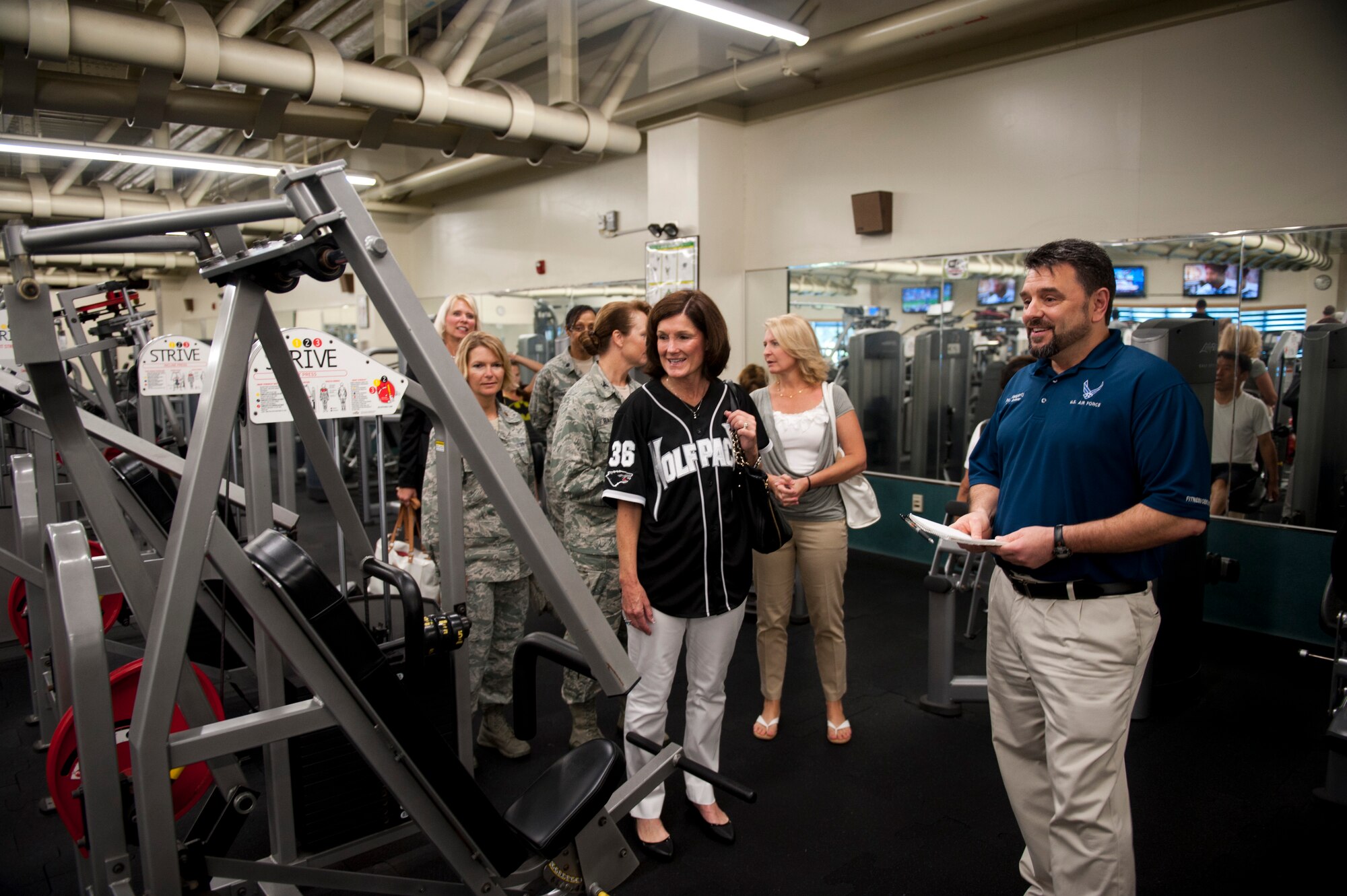 KUNSAN AIR BASE, Republic of Korea – Paul Heagerty, 8th Force Support Squadron fitness director, tells Betty Welsh, wife of Air Force Chief of Staff Gen. Mark A. Welsh III, about the fitness options available to Airmen at Kunsan Air Base Fitness Center Aug. 24, 2013. Welsh and Athena Cody, wife of Chief Master Sgt. of the Air Force James A. Cody, toured the base and met with Wolf Pack members to discuss the challenges and opportunities of caring for Airmen and their families. (U.S. Air Force photo by Senior Airman Clayton Lenhardt/Released)